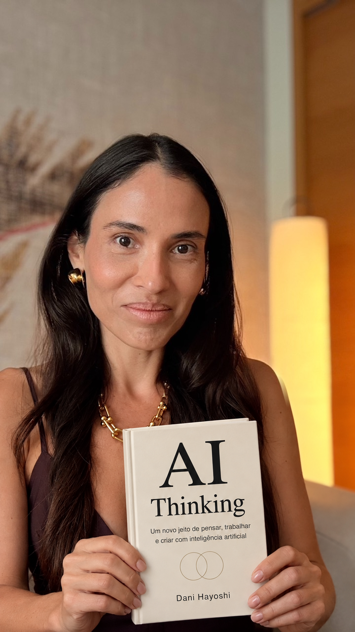 Dani Hayoshi holding AI Thinking — photographic composite